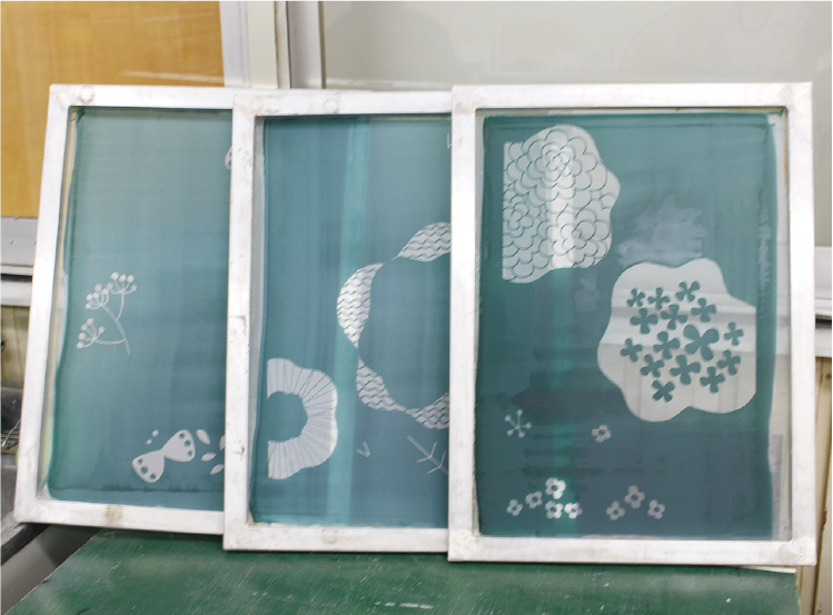 A separate silkscreen stencil is prepared for each color