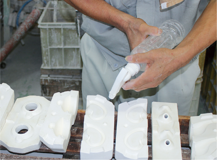 Moisture the plaster mold to help the clay adhere better.